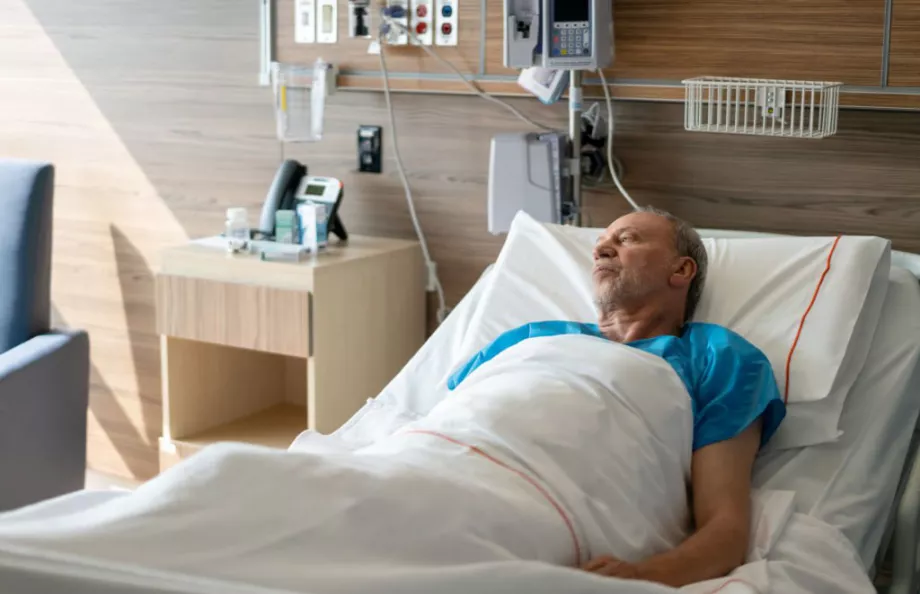 Hispanic man in a hospital bed